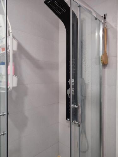 a shower with a glass door in a bathroom at CasaBarreiro in Barreiro