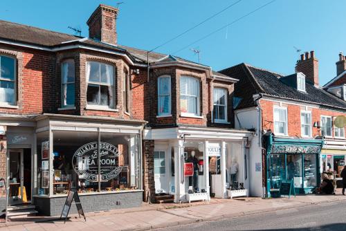 a row of shops on a city street at 72a High Street in Southwold