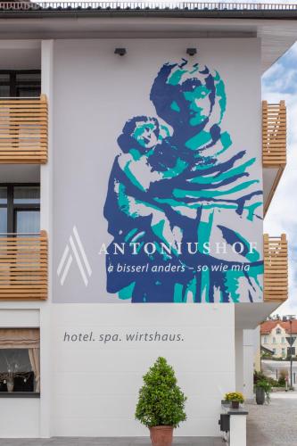 a sign on the side of a building at Hotel Antoniushof in Ruhstorf