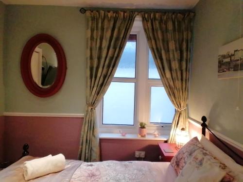 Cama o camas de una habitación en Longcroft Lodge
