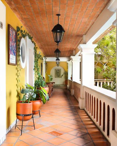 a hallway of a house with a wooden ceiling at Parador del Dominico in Oaxaca City