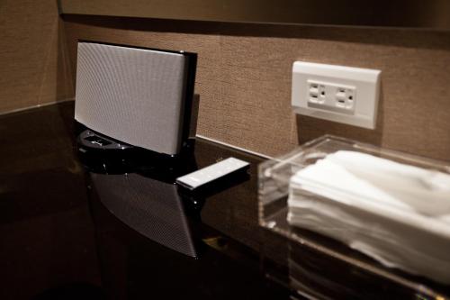 a glass counter in a hotel room with a counter top at Green Hotel in Magong