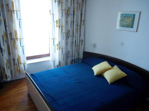Postel nebo postele na pokoji v ubytování Apartments Lada