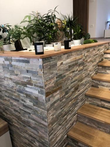 a brick counter with potted plants on it at Garden House in Kranj