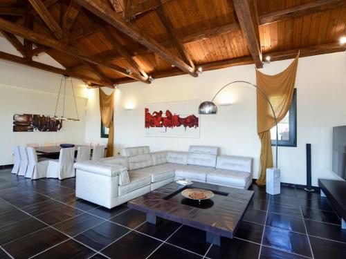 a living room with a couch and a table at Ferenity in Iraklitsa