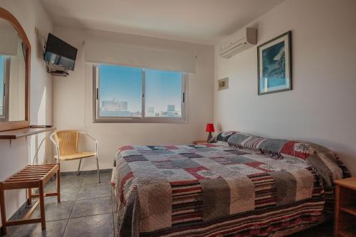Ένα ή περισσότερα κρεβάτια σε δωμάτιο στο Apart Hotel Punta Azul