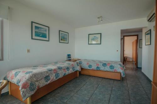 Ένα ή περισσότερα κρεβάτια σε δωμάτιο στο Apart Hotel Punta Azul