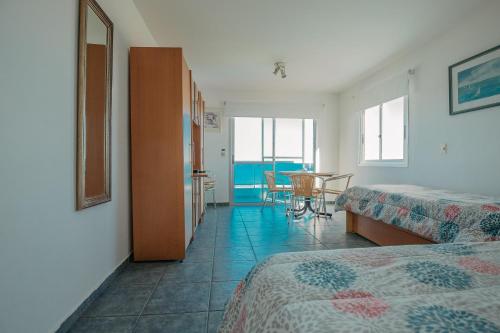 Ένα ή περισσότερα κρεβάτια σε δωμάτιο στο Apart Hotel Punta Azul