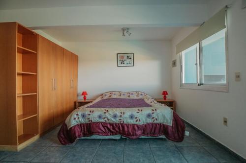 Ένα ή περισσότερα κρεβάτια σε δωμάτιο στο Apart Hotel Punta Azul