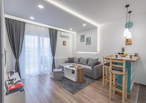 a living room with a couch and a table at Apartman Kesten - Апартман Кестен in Banja Koviljača