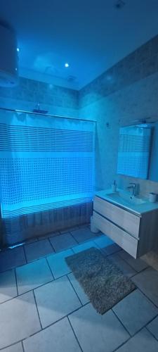 a bathroom with a tub and a sink and a mirror at Il Faro in Barletta