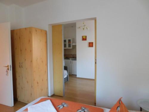 a room with a door and a room with a kitchen at Éden II. in Miskolctapolca