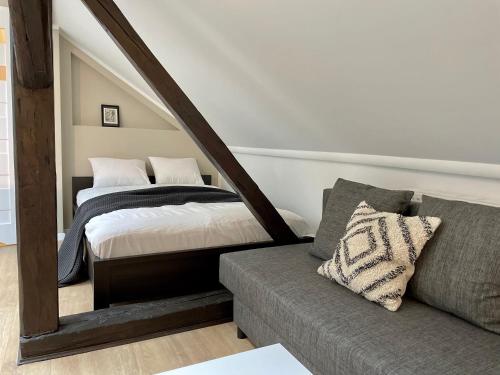 Ένα ή περισσότερα κρεβάτια σε δωμάτιο στο Apartamenty Delecta