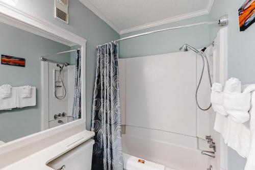 a bathroom with a shower and a mirror at ABPAB89 A Place at the Beach 355 in Atlantic Beach