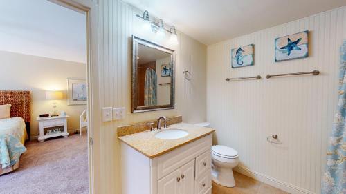 a bathroom with a sink and a toilet at 213 Turnberry Village in Hilton Head Island