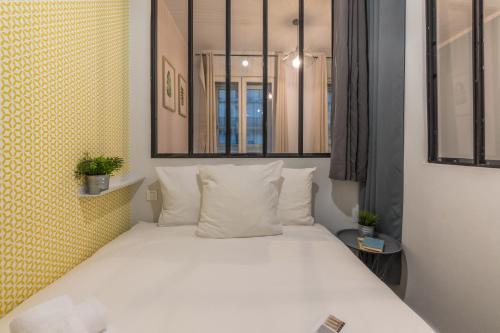 Katil atau katil-katil dalam bilik di WS Hôtel de Ville - Le Marais