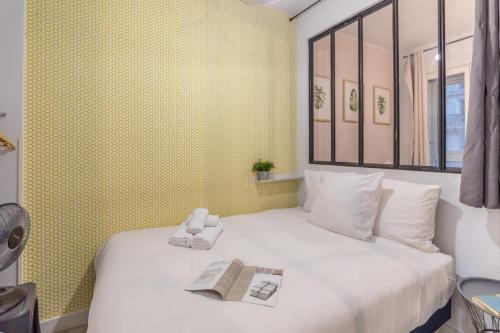 Katil atau katil-katil dalam bilik di WS Hôtel de Ville - Le Marais