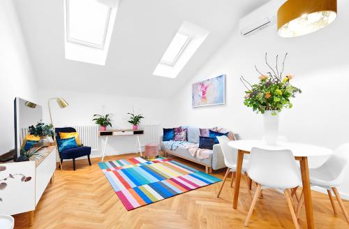 a living room with a couch and a table at Residence Dlouha - Old Town in Prague