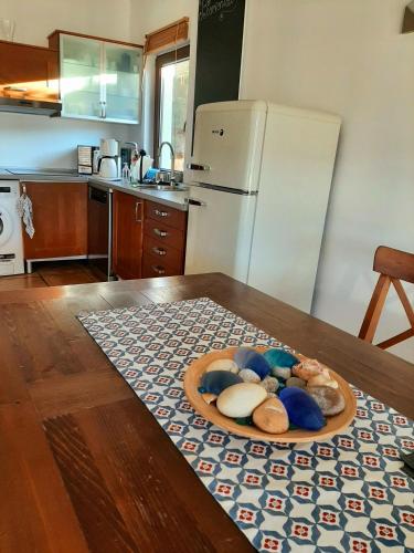 a kitchen with a plate of food on a table at Casa Sol with private terrace, garden, pool, beautiful view in Port de Soller