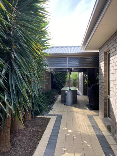 a walkway leading into a house with a heater at Casavino Luxury Villa in McLaren Vale