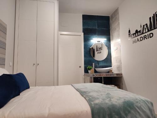 a bedroom with a bed and a sink at Estudio Madrid Norte 2 in Madrid