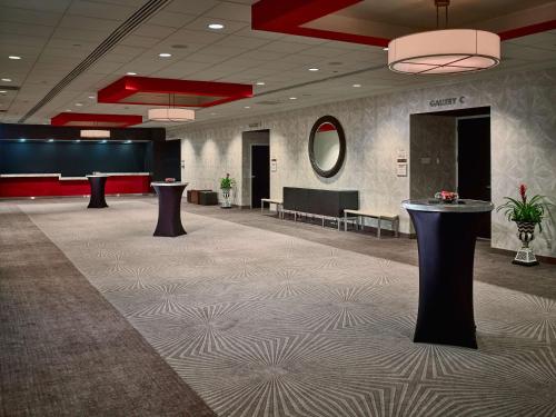 a lobby with two tables in the middle of a room at Sonesta Philadelphia Rittenhouse Square in Philadelphia