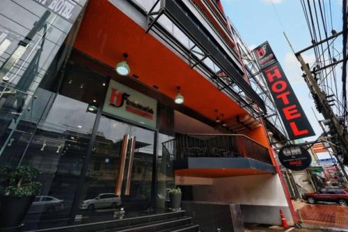 a dunkin donuts restaurant with an orange facade at The Harbour Front Hotel in Suratthani