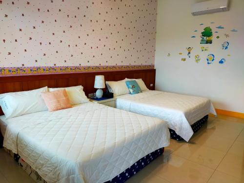 Postel nebo postele na pokoji v ubytování Jia Yuan Homestay