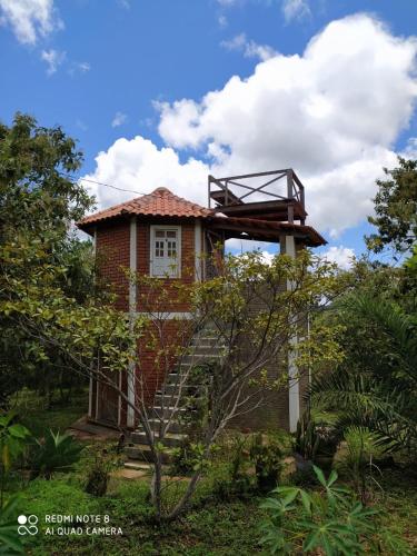 a small house with a staircase leading up to it at Hospedagem Sabor Da Trilha in Vale do Capao