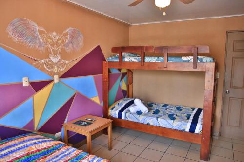 Postel nebo postele na pokoji v ubytování Mangifera Hostel