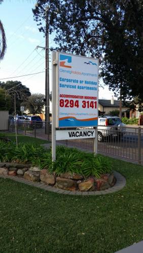 a sign for a water agency in a yard at Glenelg Holiday Apartments - Corfu 200 meters to the beach Free Parking in Adelaide