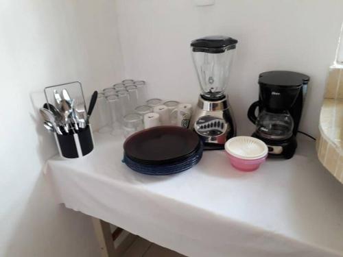 a counter with a blender and other items on it at Nice house Casa de Descanso en San Andrés Tuxtla. in San Andrés Tuxtla