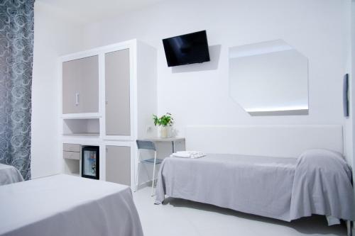 Letto o letti in una camera di Hotel Regina