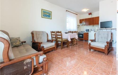 Televízia a/alebo spoločenská miestnosť v ubytovaní Apartment Okrug Donji Osoje