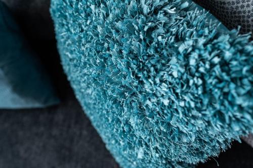 a close up of a blue rug at French Quarter Q in New Orleans