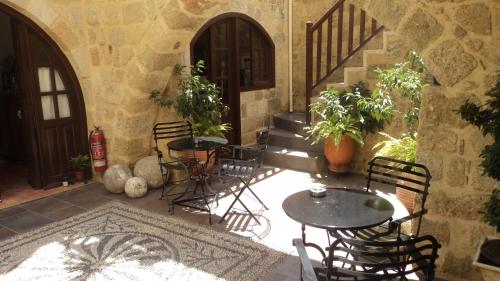 A porch or other outdoor area at Camelot Traditional & Classic Hotel