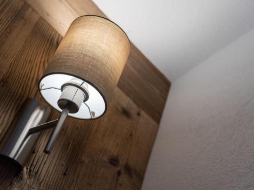 a lamp hanging from the ceiling in a room at Chalet in Kleinarl near Ski Amadé Slopes in Kleinarl