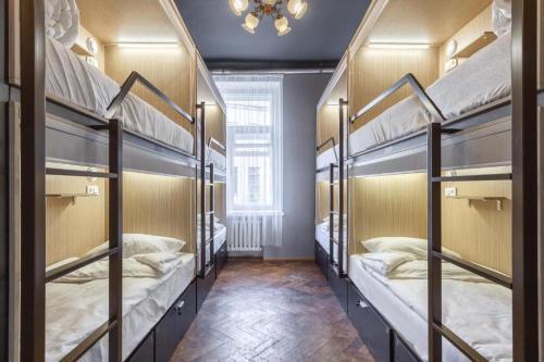 a room with four bunk beds in a hostel at Hostel 5Nebo in Moscow