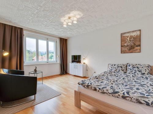 a bedroom with a bed and a large window at Apartment in St Lambrecht near ski area in Sankt Lambrecht