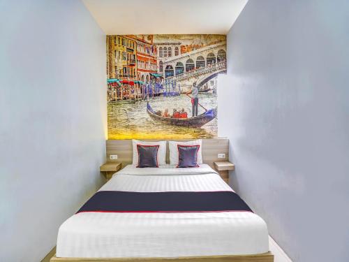 Säng eller sängar i ett rum på Capital O 90888 Bintang Diponggo Residence