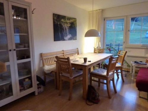 a dining room with a table and chairs at Apartment in St Margarethen in the ski area in Sankt Margarethen im Lungau