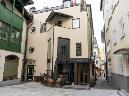 a building in the middle of a street at Comfortable Apartment in Zell am See near Forest in Zell am See