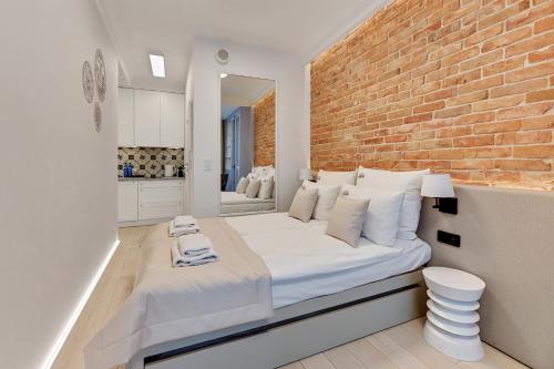 Postel nebo postele na pokoji v ubytování Downtown Apartments Riverside Granaria