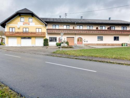 a building on the side of a road at Beautiful Holiday Home in Ulrichsberg with Balcony in Ulrichsberg