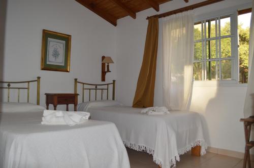 Ένα ή περισσότερα κρεβάτια σε δωμάτιο στο Hosteria Magdalena