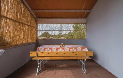 a room with a bench in a room with a window at Amazing Home In Marcana With House A Panoramic View in Divšići
