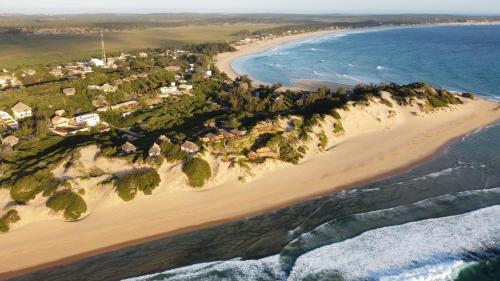 an aerial view of a beach next to the ocean at Bela Flor Beach Front Apartments in Inhambane