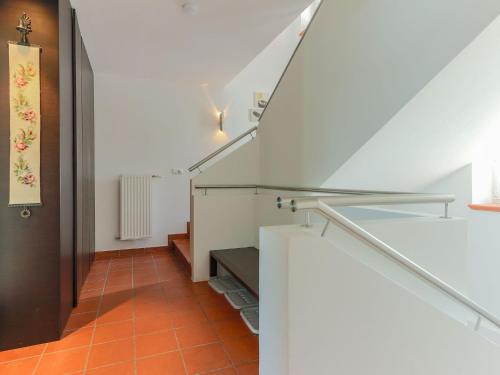 an orange tiled hallway with stairs in a house at Chalet in Krimml near Zillertal Slopes in Krimml
