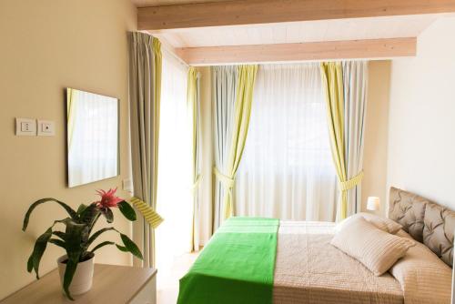 Postel nebo postele na pokoji v ubytování Resort Cupra