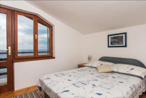 Posteľ alebo postele v izbe v ubytovaní Apartment Tomisha